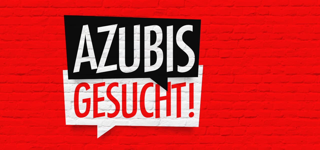 Rote Steinwand mit schwarz-weißer Sprechblase "Azubis gesucht" | Motiv ©Brad Pict - stock.adobe.com | © stock.adobe.com, Juni 2022