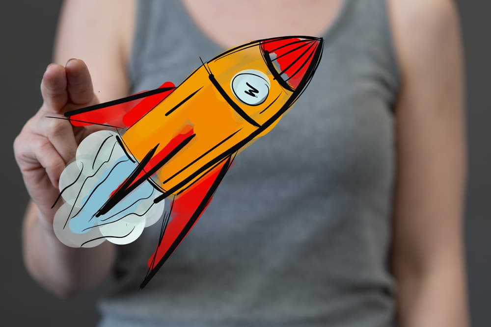 F Gründen neu (jpg) | Motiv © vege, fotolia.com | © www.fotolia.com, Juni 2018 Eine Frau hält eine gemalte Rakete. | Motiv © vege, fotolia.com | © www.fotolia.com, Juni 2018